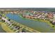 Breathtaking aerial shot of a waterfront community with beautiful homes and lush landscaping at 2541 Shoal Bass Way, Kissimmee, FL 34746