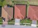 Overhead shot of a terracotta-roofed home boasting meticulous landscaping at 2541 Shoal Bass Way, Kissimmee, FL 34746