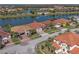 Eye-catching aerial view captures homes along a scenic waterway, with lush lawns and various boat docks visible at 2541 Shoal Bass Way, Kissimmee, FL 34746
