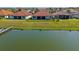 Waterfront homes with well-maintained lawn and fenced-in yard, perfect for outdoor enjoyment and relaxation at 2541 Shoal Bass Way, Kissimmee, FL 34746