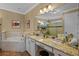 A luxurious bathroom with dual vanities, soaking tub, and walk-in shower at 2541 Shoal Bass Way, Kissimmee, FL 34746