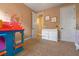 Playful ' room featuring colorful decor, a changing table, and carpeted flooring at 2541 Shoal Bass Way, Kissimmee, FL 34746