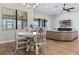 Inviting dining room blends with the living space, accented by natural light and contemporary decor at 2541 Shoal Bass Way, Kissimmee, FL 34746