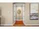 Hallway with decorative mirror in the archway at 2541 Shoal Bass Way, Kissimmee, FL 34746