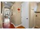 Hallway featuring hardwood floors leading to the shower and other rooms at 2541 Shoal Bass Way, Kissimmee, FL 34746