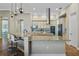 This island kitchen has a granite countertop and modern, stainless steel appliances at 2541 Shoal Bass Way, Kissimmee, FL 34746