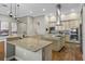 Gourmet kitchen featuring granite counters, a central island, and built-in appliances for modern cooking at 2541 Shoal Bass Way, Kissimmee, FL 34746