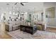 Spacious living room featuring an oversized sectional sofa, wood floors and an open floor plan at 2541 Shoal Bass Way, Kissimmee, FL 34746
