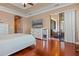 Cozy main bedroom with a dresser, TV and sliding doors to an outdoor space at 2541 Shoal Bass Way, Kissimmee, FL 34746