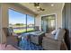 Inviting screened patio features comfortable seating with a lovely lake view at 2541 Shoal Bass Way, Kissimmee, FL 34746