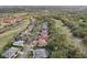 A picturesque neighborhood with homes nestled amidst lush greenery and a tranquil lake and golf course at 2747 Kissimmee Bay Cir, Kissimmee, FL 34744