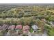 Aerial view of luxury homes set within lush landscaping, mature trees, and meticulously manicured lawns at 2747 Kissimmee Bay Cir, Kissimmee, FL 34744