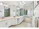 Elegant bathroom with dual vanities, a jacuzzi tub, and luxury finishes at 2747 Kissimmee Bay Cir, Kissimmee, FL 34744