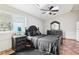 Bedroom featuring hardwood floors and black furniture at 2747 Kissimmee Bay Cir, Kissimmee, FL 34744