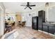 Bright dining area features a ceiling fan, neutral paint, a table for four, and access to the kitchen at 2747 Kissimmee Bay Cir, Kissimmee, FL 34744