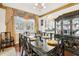 Elegant dining room with decorative details, hardwood floors, and large windows at 2747 Kissimmee Bay Cir, Kissimmee, FL 34744