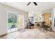 Relaxing living area with neutral paint, tiled floors, access to the backyard, and plenty of natural light at 2747 Kissimmee Bay Cir, Kissimmee, FL 34744