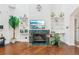 Living room with hardwood floors, fireplace with green marble, and built-in shelves at 2747 Kissimmee Bay Cir, Kissimmee, FL 34744
