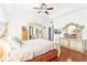 Spacious primary bedroom with trey ceilings, wood floors, and decorative furniture at 2747 Kissimmee Bay Cir, Kissimmee, FL 34744