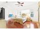 The main bedroom features tray ceiling, hardwood floors, a ceiling fan, and two windows with blinds at 2747 Kissimmee Bay Cir, Kissimmee, FL 34744