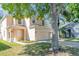 Inviting two-story home featuring a spacious two-car garage and well-maintained lawn with mature trees at 322 Lusitano Way, Sanford, FL 32773