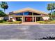 An inviting exterior with a covered walkway and a striking red double-door entry at 3242 S Semoran Blvd # 21, Orlando, FL 32822