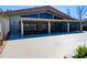 Community clubhouse featuring a screened-in porch and large concrete pad at 3242 S Semoran Blvd # 21, Orlando, FL 32822