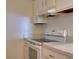 View of the kitchen featuring white appliances and plenty of counter space at 3242 S Semoran Blvd # 21, Orlando, FL 32822