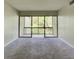Bright living room with sliding door access to screened patio at 3242 S Semoran Blvd # 21, Orlando, FL 32822
