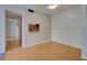 Bright living room with hardwood floors and pass-through to the kitchen at 3242 S Semoran Blvd # 21, Orlando, FL 32822