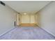 View of the spacious living room featuring neutral paint, and a closet near the entry at 3242 S Semoran Blvd # 21, Orlando, FL 32822
