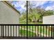 View from patio offers a view of the complex's lawn, landscaping, and walking path at 3242 S Semoran Blvd # 21, Orlando, FL 32822