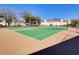 Outdoor tennis courts with green surface and community buildings at 3242 S Semoran Blvd # 21, Orlando, FL 32822