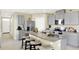 Kitchen featuring gray cabinets, stainless steel appliances, granite countertops and a large kitchen island at 3633 Salvia Ct, Tavares, FL 32778