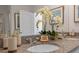 Elegant bathroom with granite countertop, dual sinks, and decorative orchids at 3893 Diving Dove Ln, Bartow, FL 33830