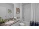 Bathroom featuring a single sink vanity with granite countertops and a shower-tub combo at 3893 Diving Dove Ln, Bartow, FL 33830
