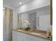 Bright bathroom featuring double sinks, granite countertops and decorative elements at 3893 Diving Dove Ln, Bartow, FL 33830