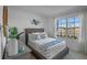 Inviting bedroom with a large window, wicker headboard, and stylish decor at 3893 Diving Dove Ln, Bartow, FL 33830