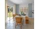 Bright dining area features stylish furnishings, and a sliding glass door opening to the outdoors at 3893 Diving Dove Ln, Bartow, FL 33830