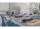 Kitchen island featuring granite countertops, barstool seating, and stainless steel appliances at 3893 Diving Dove Ln, Bartow, FL 33830