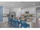 Modern kitchen island featuring granite countertops, a breakfast bar, and ample seating for casual dining at 3901 Diving Dove Ln, Bartow, FL 33830