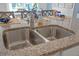 Close up of kitchen sink with granite countertops and stainless steel faucet at 3901 Diving Dove Ln, Bartow, FL 33830