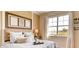 Inviting bedroom with a plush bed, ample natural light from the window, and serene outdoor view at 3965 Kennebunk Loop, Mount Dora, FL 32757