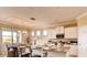 Bright, well-equipped kitchen with stainless steel appliances, granite counters, and an island with seating at 3965 Kennebunk Loop, Mount Dora, FL 32757