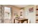 Bright room with a wood desk and paintings at 3965 Kennebunk Loop, Mount Dora, FL 32757