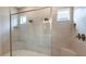 Modern bathroom featuring a glass-enclosed shower with dual showerheads and a built-in bench at 4197 Barbuda Ln, Kissimmee, FL 34758