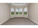 Comfortable bedroom featuring neutral walls, plush carpeting, and a bay window offering serene views at 4197 Barbuda Ln, Kissimmee, FL 34758