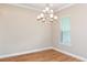 Dining room featuring new chandelier and tile floors at 4197 Barbuda Ln, Kissimmee, FL 34758