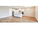 Spacious kitchen with white cabinets, stainless steel appliances, and center island at 4197 Barbuda Ln, Kissimmee, FL 34758