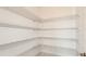 Walk-in pantry providing ample storage with adjustable wire shelving and maximizing organizational potential at 4197 Barbuda Ln, Kissimmee, FL 34758